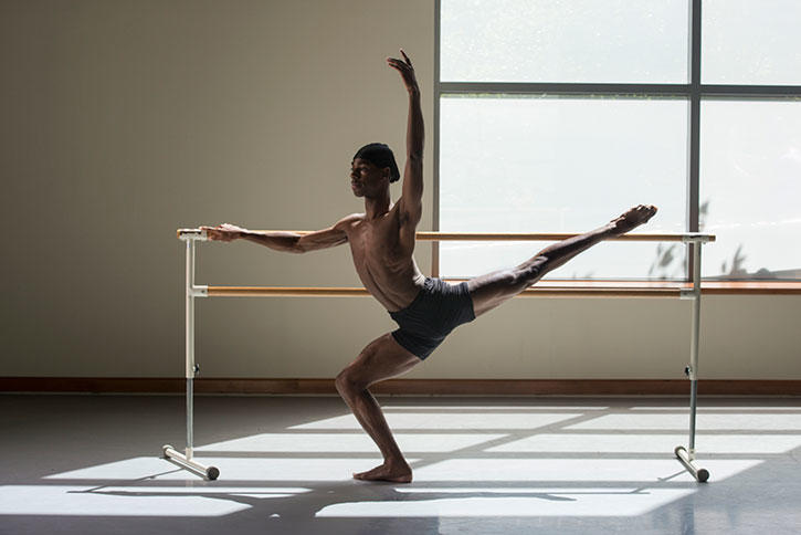 A dance student, Dony'ae Bush, stretches in one of our studios